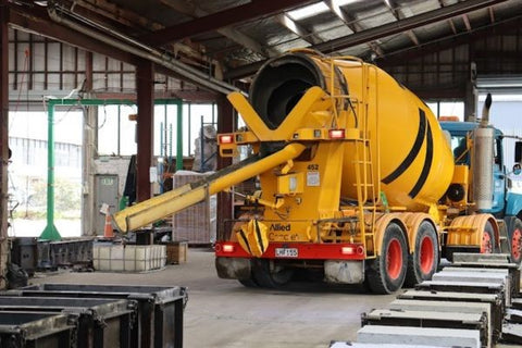 Allied Concrete truck leaving Envirocon Penrose Yard, Stonebloc in the foreground of photo